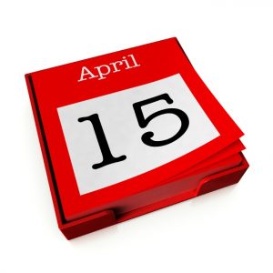 A tear-off reminder calendar displqaying the date "April 15th" against a white background.